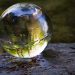 Globe of ice with the refection of a river